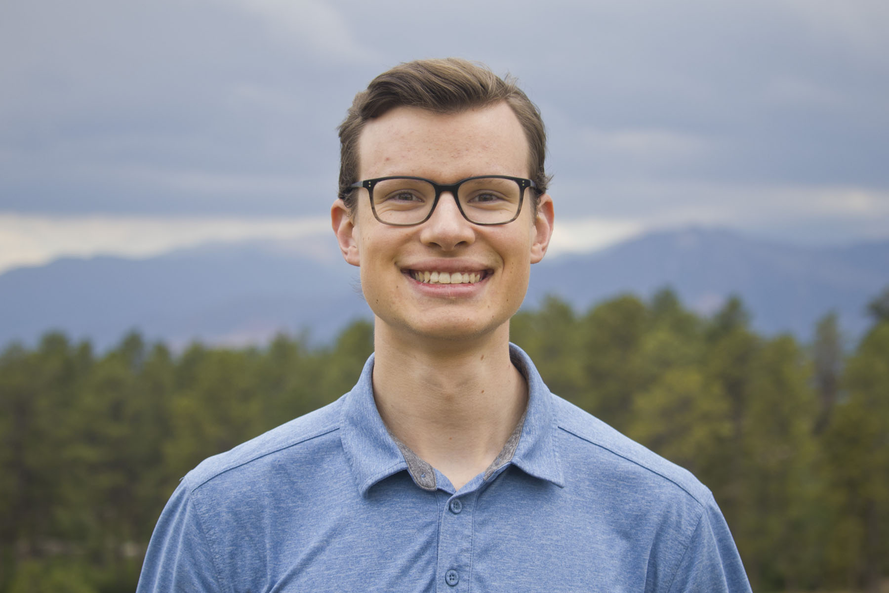 Photo portrait of Ethan at Lake Claire on the UCF campus