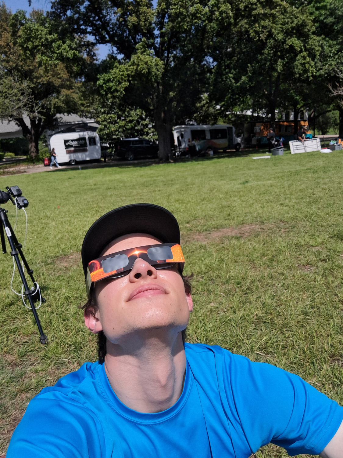 Photo of me looking up at the sun with solar viewing glasses.